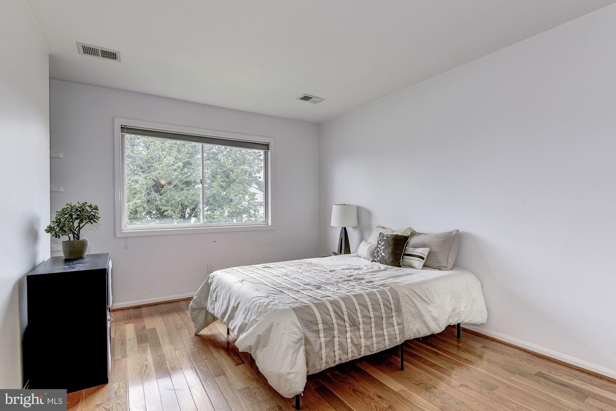 2045 North Glebe Road Arlington, VA 22207 - Photo 13 of 19 a bedroom with a bed and a window