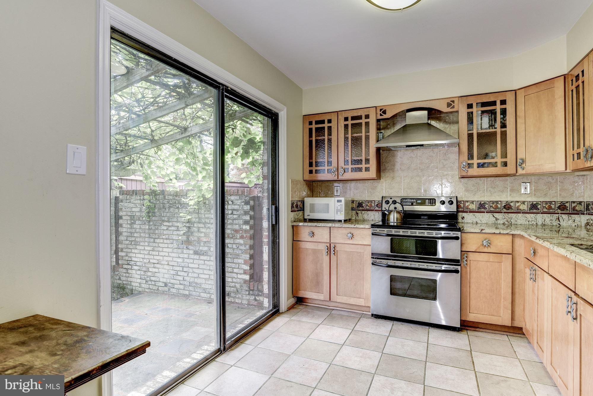 2045 North Glebe Road Arlington, VA 22207 - Photo 3 of 19 a kitchen with a stove a sink and a refrigerator