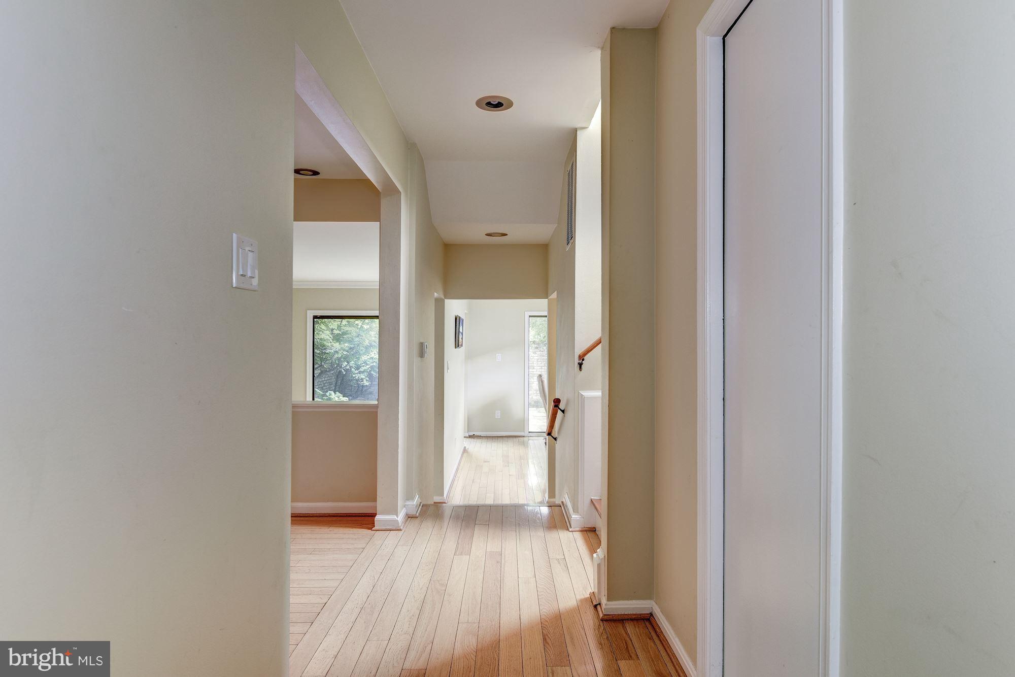 2045 North Glebe Road Arlington, VA 22207 - Photo 4 of 19 a view of a walk in closet and wooden floor