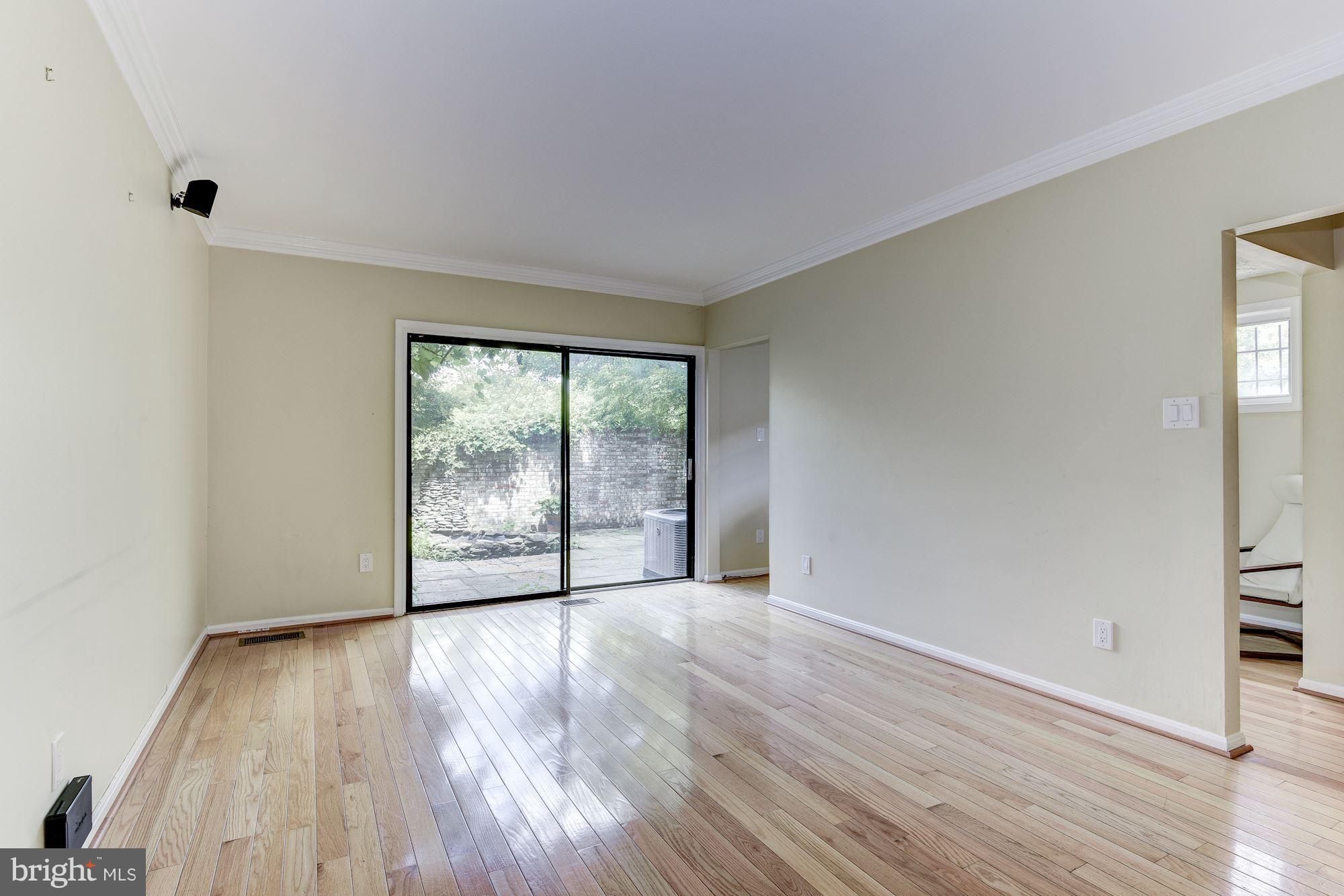 2045 North Glebe Road Arlington, VA 22207 - Photo 8 of 19 wooden floor in an empty room with a window