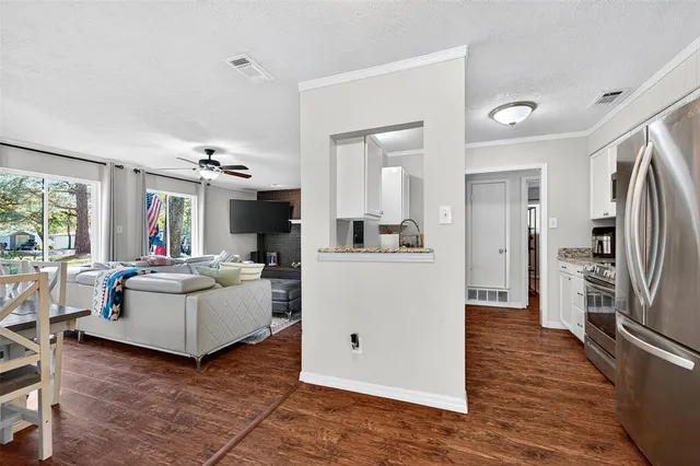 a view of a livingroom with furniture window and wooden floor