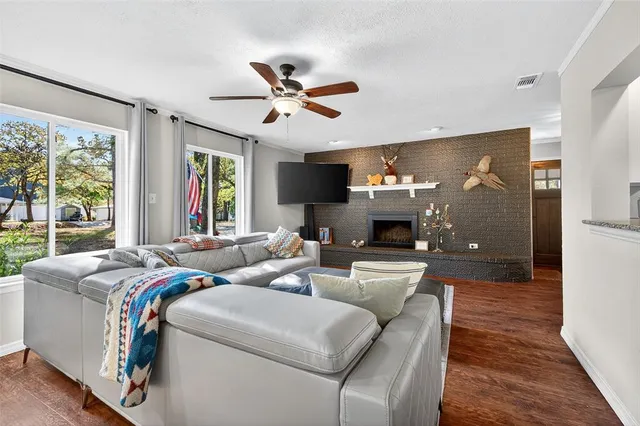 a living room with furniture and a fireplace