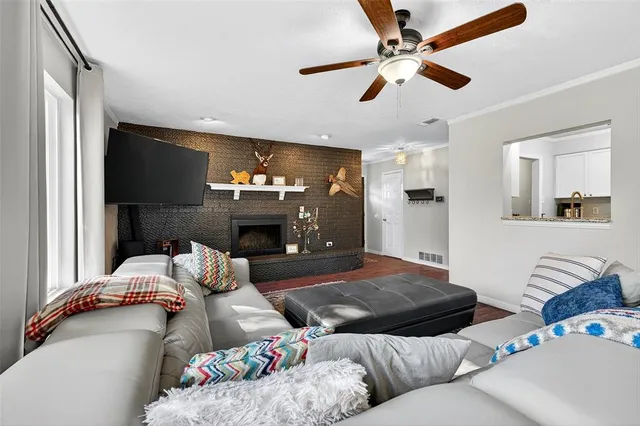 a living room with furniture and a rug