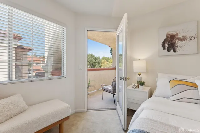 a bedroom with a bed and a couch