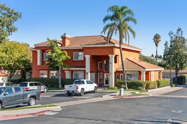a swimming pool view with a outdoor seating