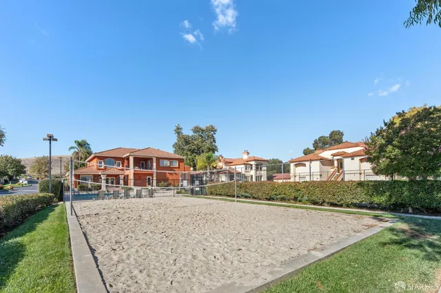 a view of a playground with basketball court