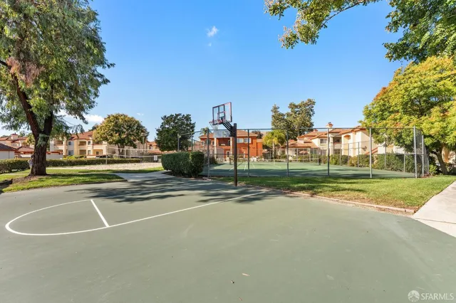 a view of a hallway with wooden floor and entryway