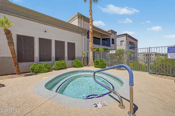 a swimming pool with outdoor seating and yard