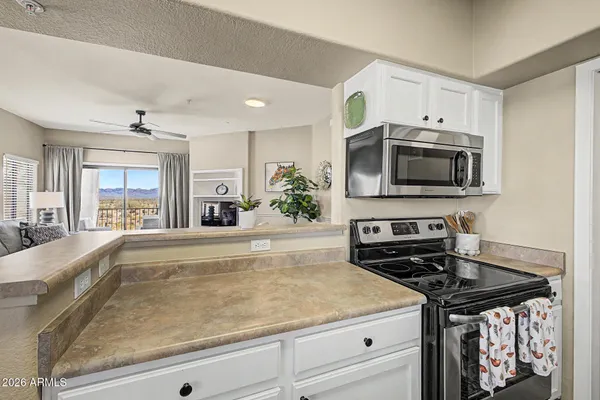 a kitchen with a stove and a microwave