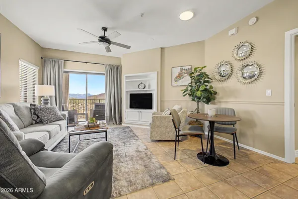 a living room with furniture and a fireplace