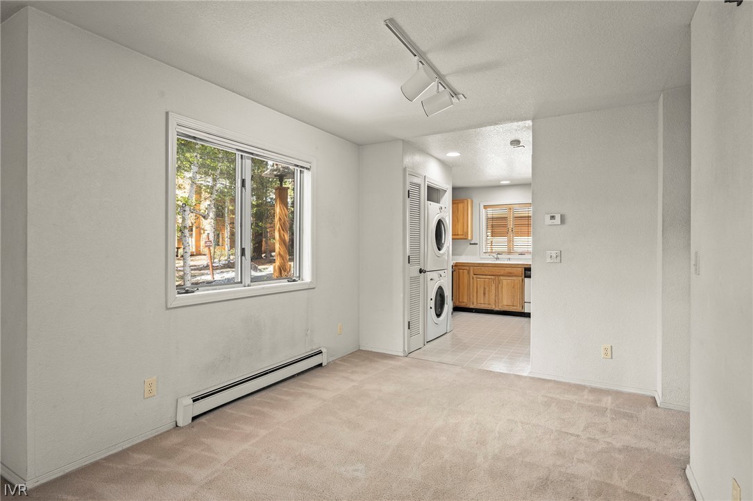 947 Incline Way, Unit 189 Incline Village, NV 89451 - Photo 7 of 21 a view of a big room with windows and chandelier fan