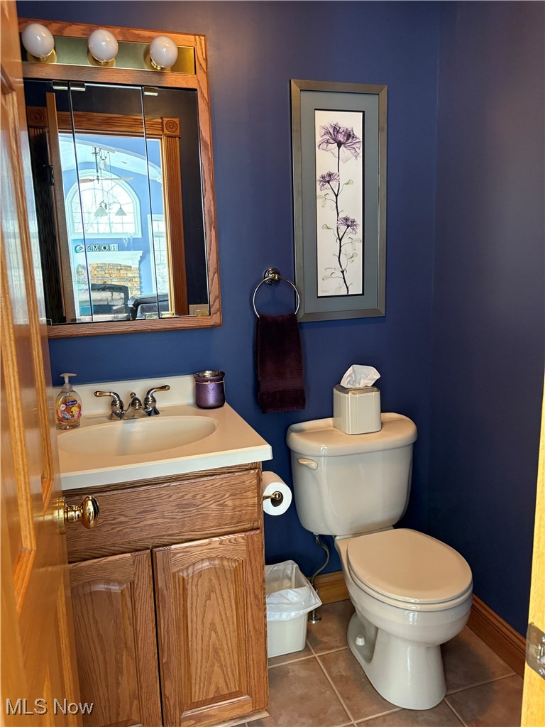 2504 Meloy Road Kent, OH 44240 - Photo 22 of 50 First Floor Half Bathroom with tile floors, vanity, and toilet