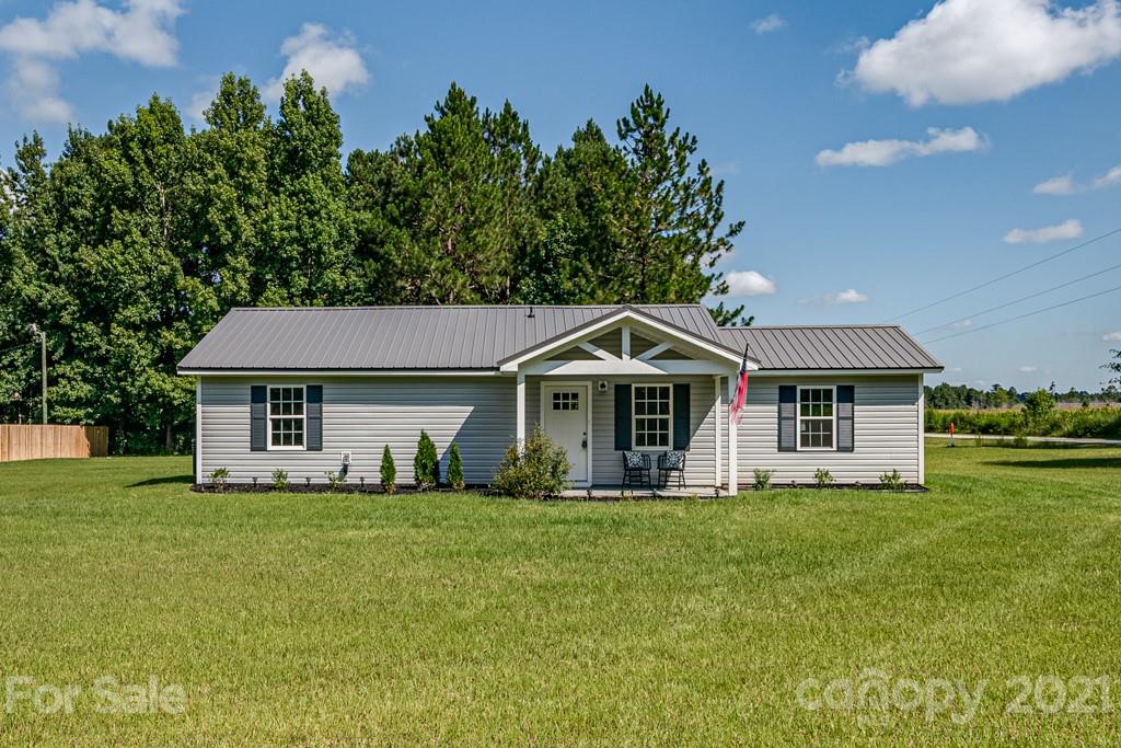 1322 Miller-Flat Road, Unit 1 Jefferson, SC 29718 - Photo 1 of 32 a front view of a house with a yard