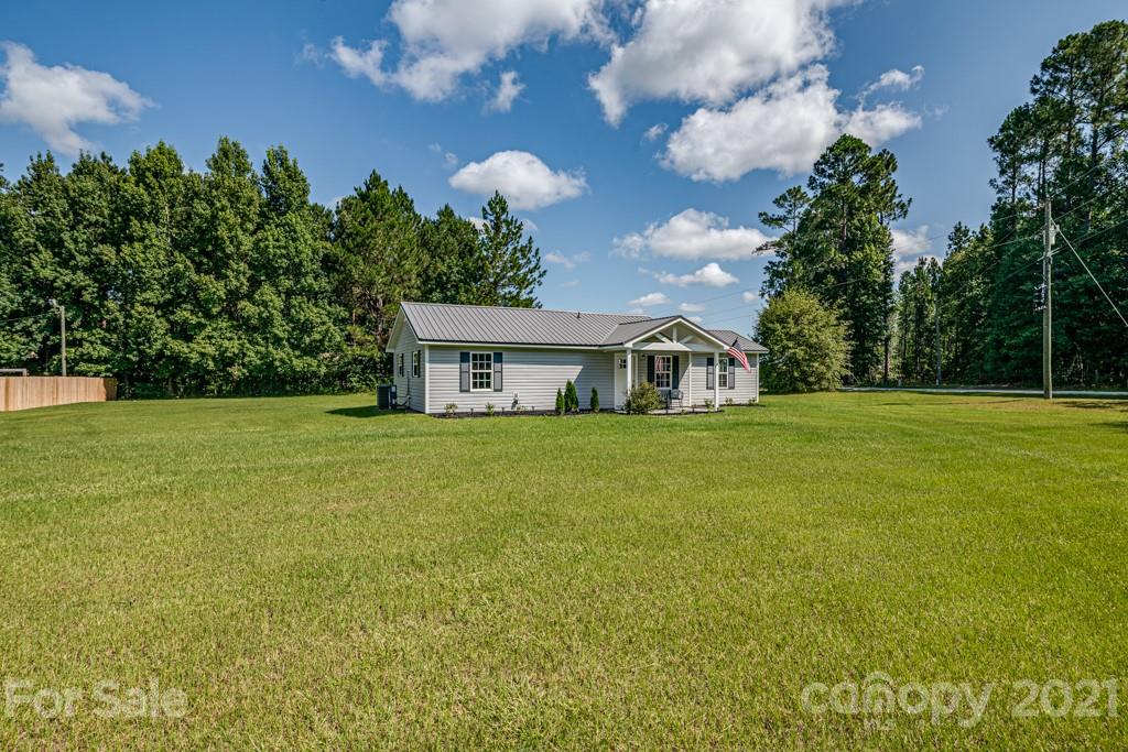 1322 Miller-Flat Road, Unit 1 Jefferson, SC 29718 - Photo 2 of 32 a front view of a house with a garden