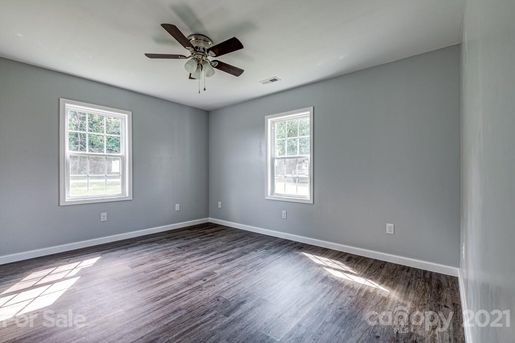 1322 Miller-Flat Road, Unit 1 Jefferson, SC 29718 - Photo 11 of 32 a view of room with window ceiling fan and hardwood floor
