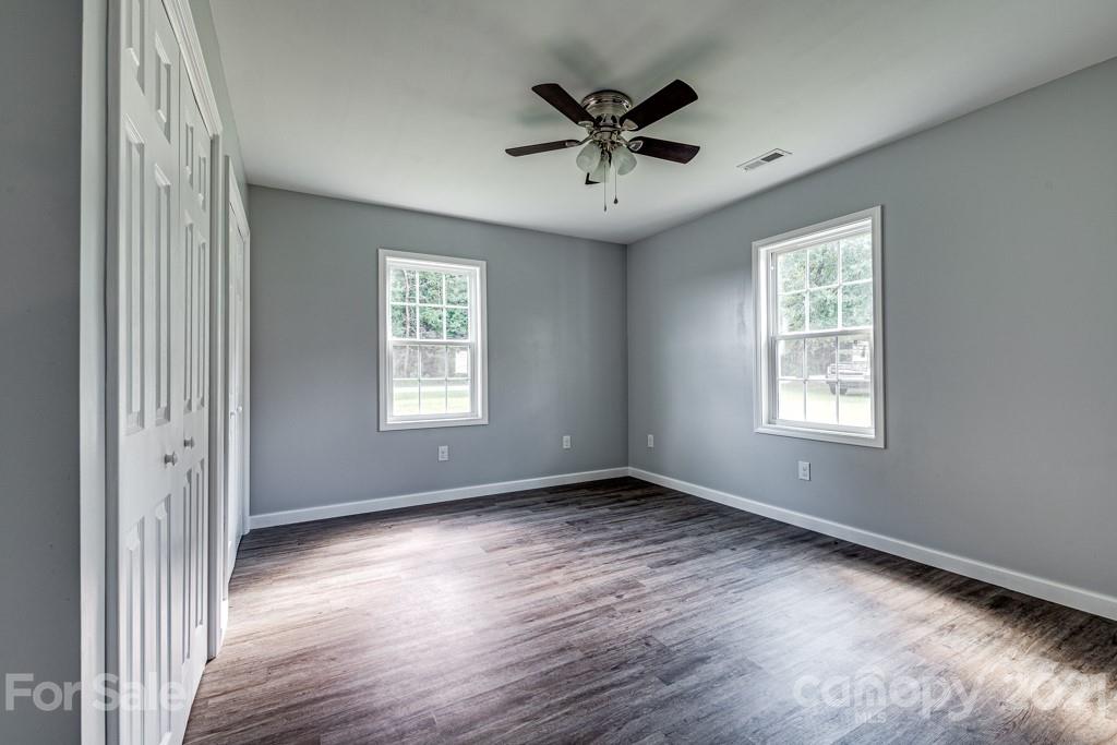 1322 Miller-Flat Road, Unit 1 Jefferson, SC 29718 - Photo 12 of 32 a view of an empty room with wooden floor and a window