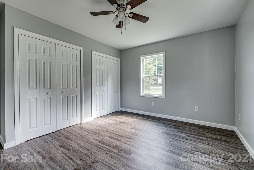 1322 Miller-Flat Road, Unit 1 Jefferson, SC 29718 - Photo 13 of 32 a view of an empty room with window and wooden floor