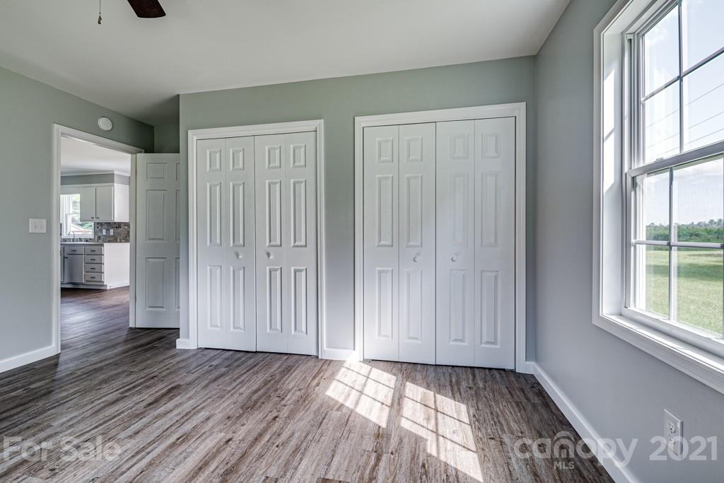 1322 Miller-Flat Road, Unit 1 Jefferson, SC 29718 - Photo 14 of 32 wooden floor in an empty room with a window
