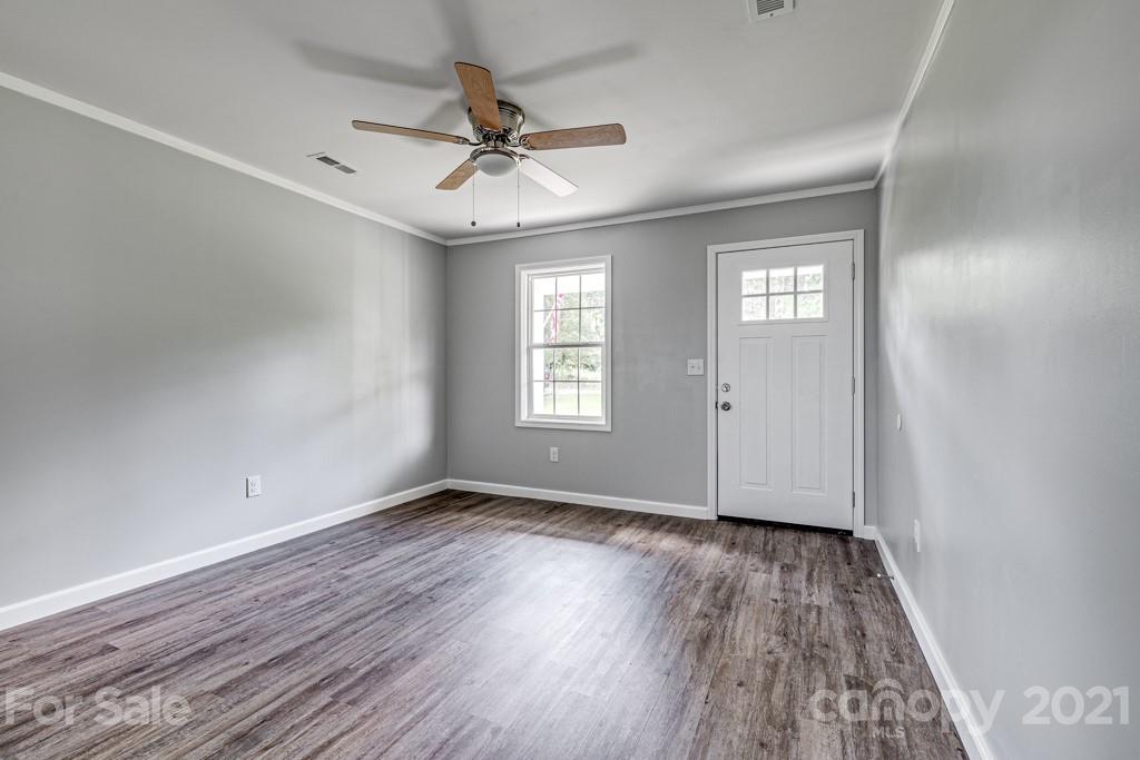 1322 Miller-Flat Road, Unit 1 Jefferson, SC 29718 - Photo 15 of 32 wooden floor in an empty room with a window