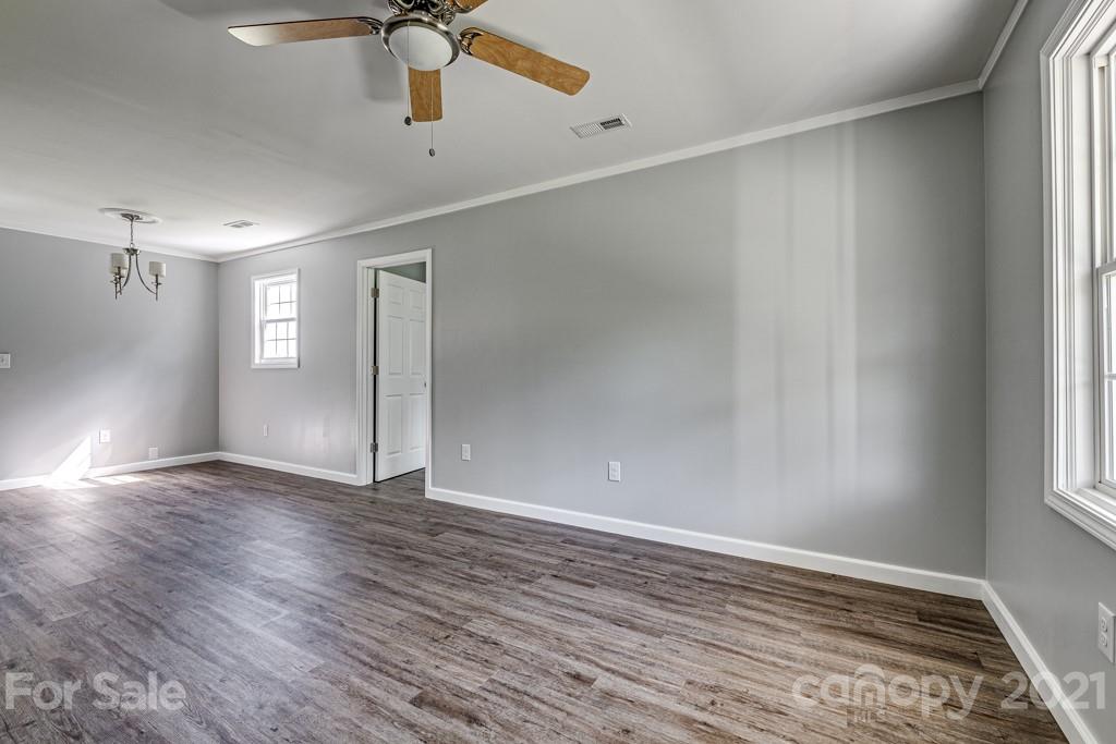 1322 Miller-Flat Road, Unit 1 Jefferson, SC 29718 - Photo 17 of 32 a view of an empty room with window and wooden floor