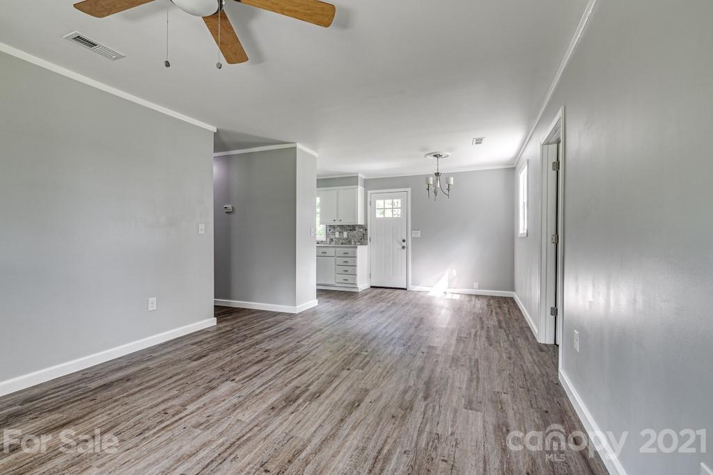 1322 Miller-Flat Road, Unit 1 Jefferson, SC 29718 - Photo 18 of 32 an empty room with wooden floor and windows