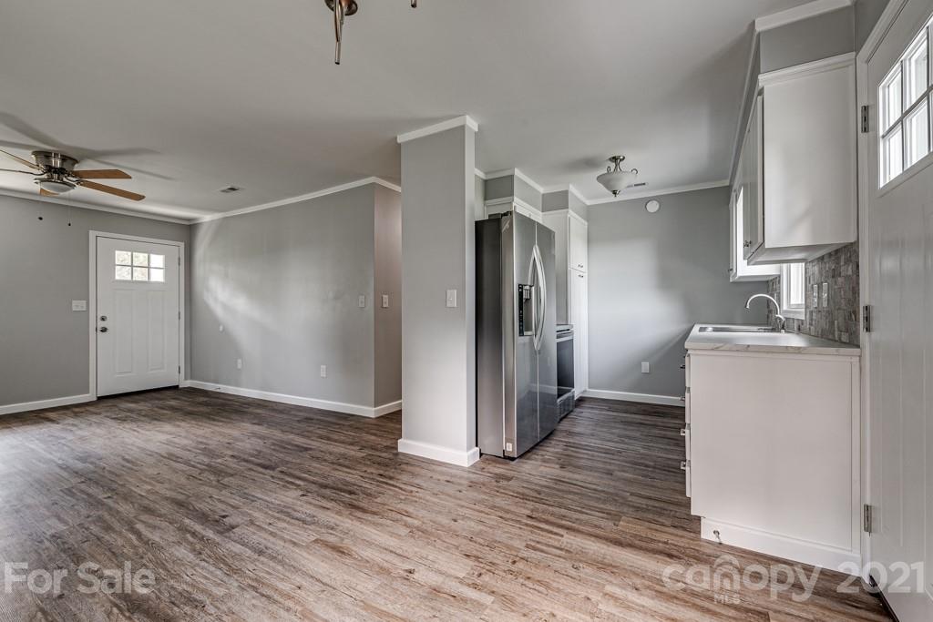 1322 Miller-Flat Road, Unit 1 Jefferson, SC 29718 - Photo 22 of 32 a view of empty room with wooden floor and fan