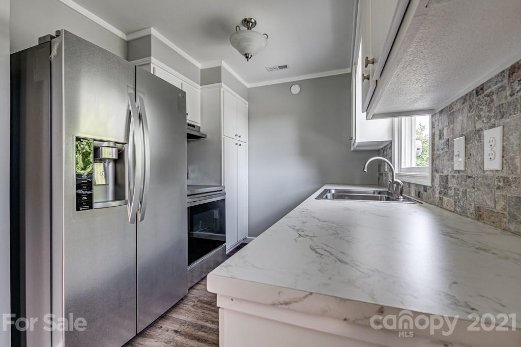 1322 Miller-Flat Road, Unit 1 Jefferson, SC 29718 - Photo 24 of 32 a kitchen with stainless steel appliances granite countertop a refrigerator and a sink