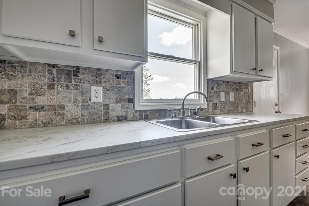 1322 Miller-Flat Road, Unit 1 Jefferson, SC 29718 - Photo 26 of 32 a sink with white cabinets
