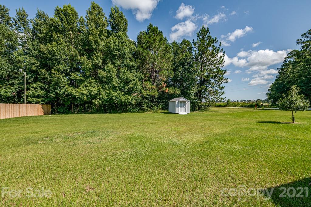 1322 Miller-Flat Road, Unit 1 Jefferson, SC 29718 - Photo 32 of 32 a view of a garden with a bench