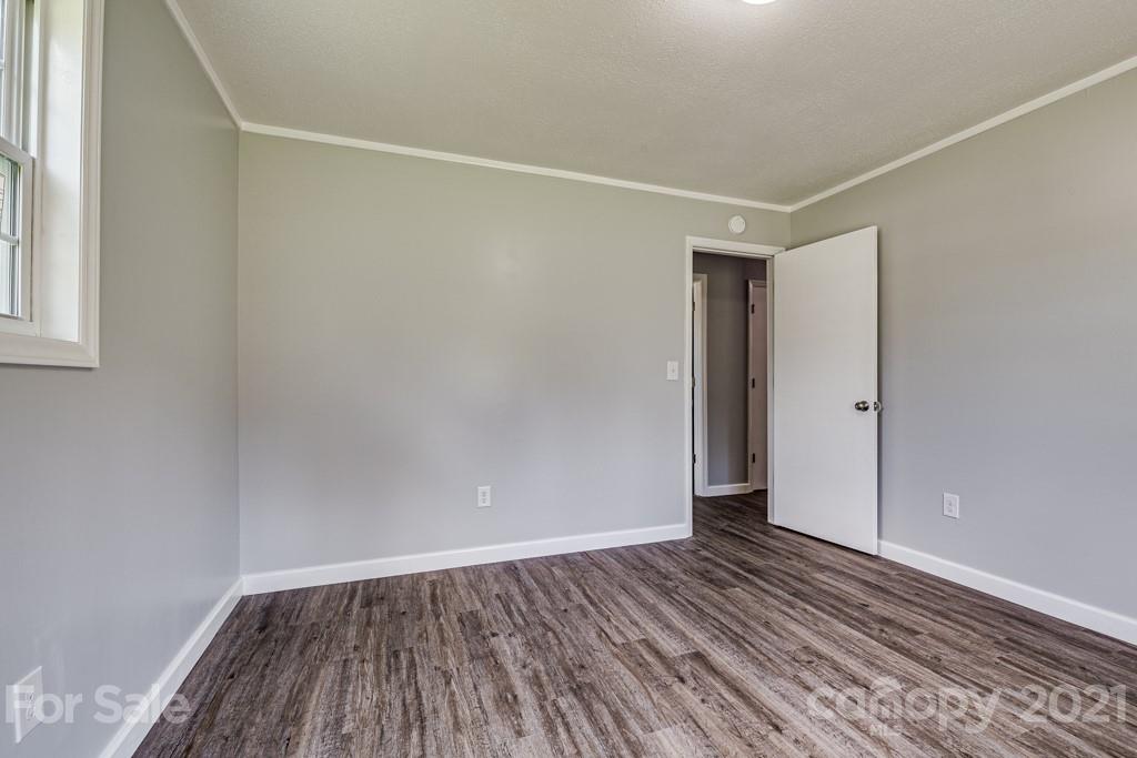 1322 Miller-Flat Road, Unit 1 Jefferson, SC 29718 - Photo 6 of 32 a view of an empty room with wooden floor and a window