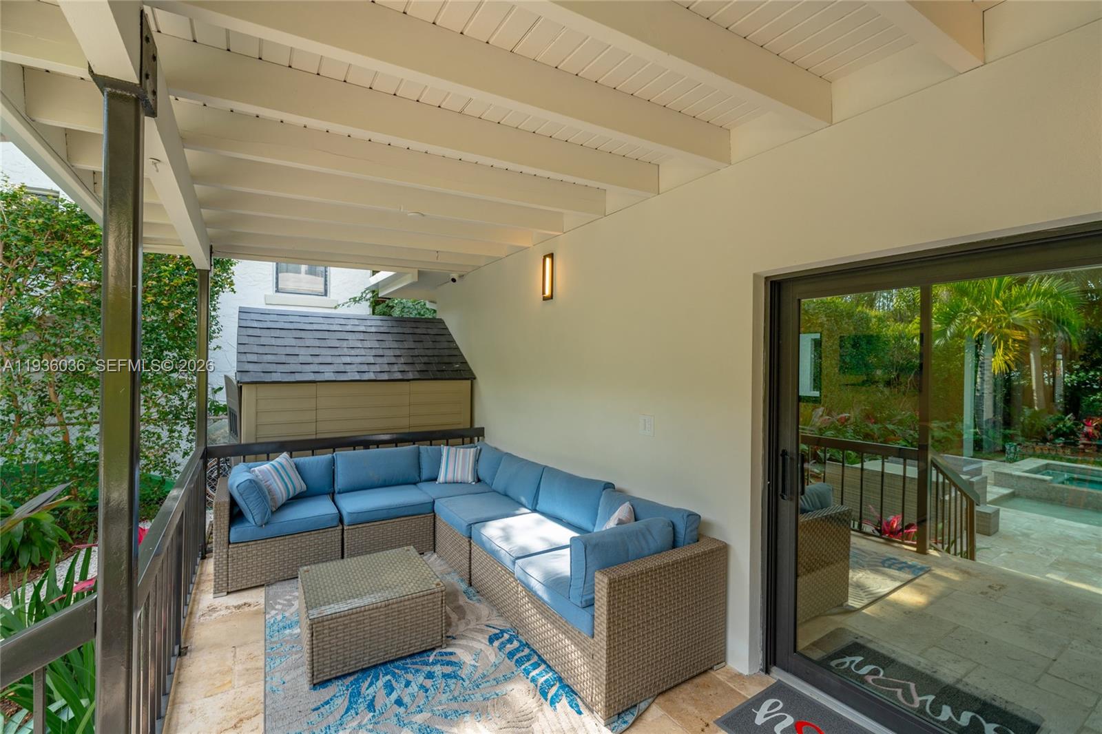 3141 North Bay Road Miami Beach, FL 33140 - Photo 19 of 50 a living room with furniture and a floor to ceiling window