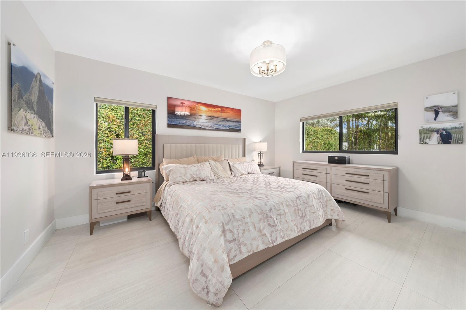 3141 North Bay Road Miami Beach, FL 33140 - Photo 24 of 50 a bedroom with a large bed and a window