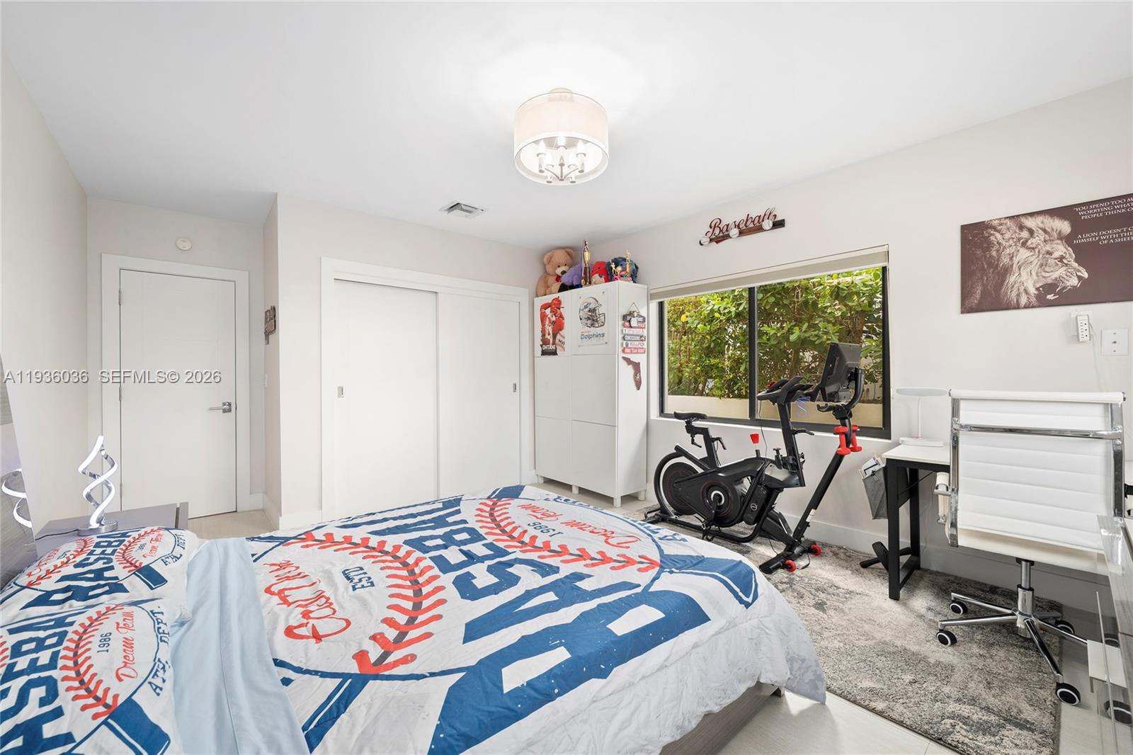 3141 North Bay Road Miami Beach, FL 33140 - Photo 32 of 50 a bedroom with a bed and a window