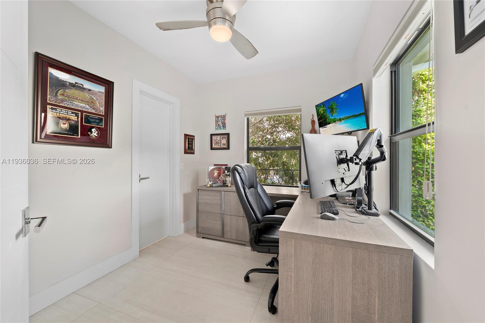 3141 North Bay Road Miami Beach, FL 33140 - Photo 34 of 50 a view of a workspace with furniture and a window