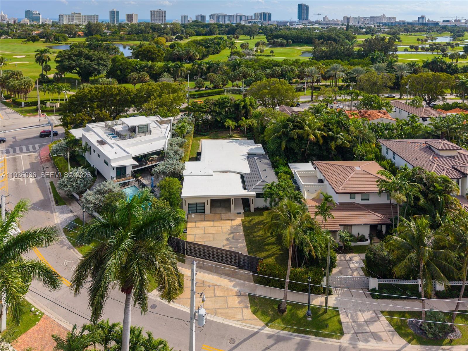 3141 North Bay Road Miami Beach, FL 33140 - Photo 38 of 50 an aerial view of multiple houses with a yard