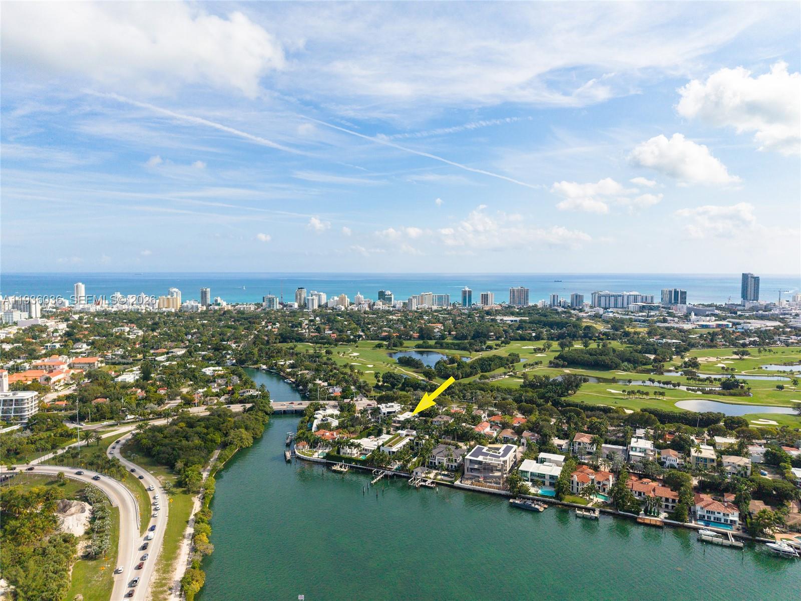 3141 North Bay Road Miami Beach, FL 33140 - Photo 47 of 50 an aerial view of a city with lots of residential buildings ocean and mountain view in back