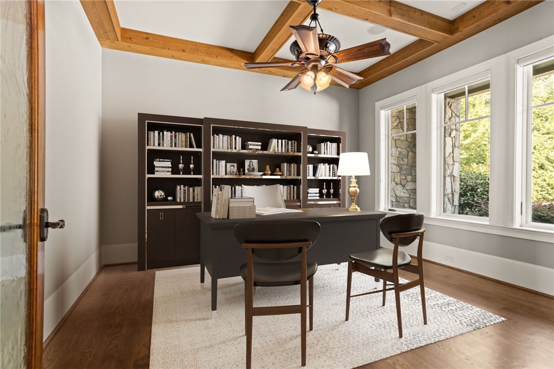 314 Palmer Way Sunset, SC 29685 - Photo 4 of 48 Rich wood-beamed ceilings and warm hardwood flooring anchor this quiet home office space.