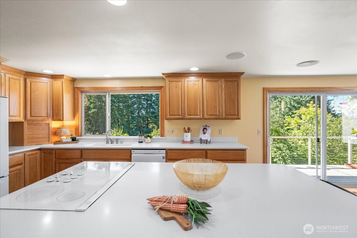 8707 45th Street West Tacoma, WA 98466 - Photo 14 of 39 a kitchen with stainless steel appliances a sink and a large window