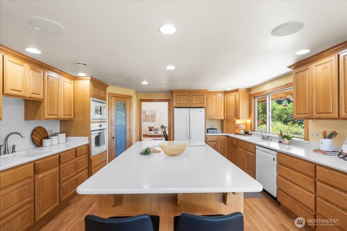 8707 45th Street West Tacoma, WA 98466 - Photo 16 of 39 a large kitchen with sink and cabinets