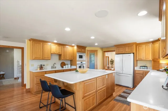 a living room with furniture a window and a dining table