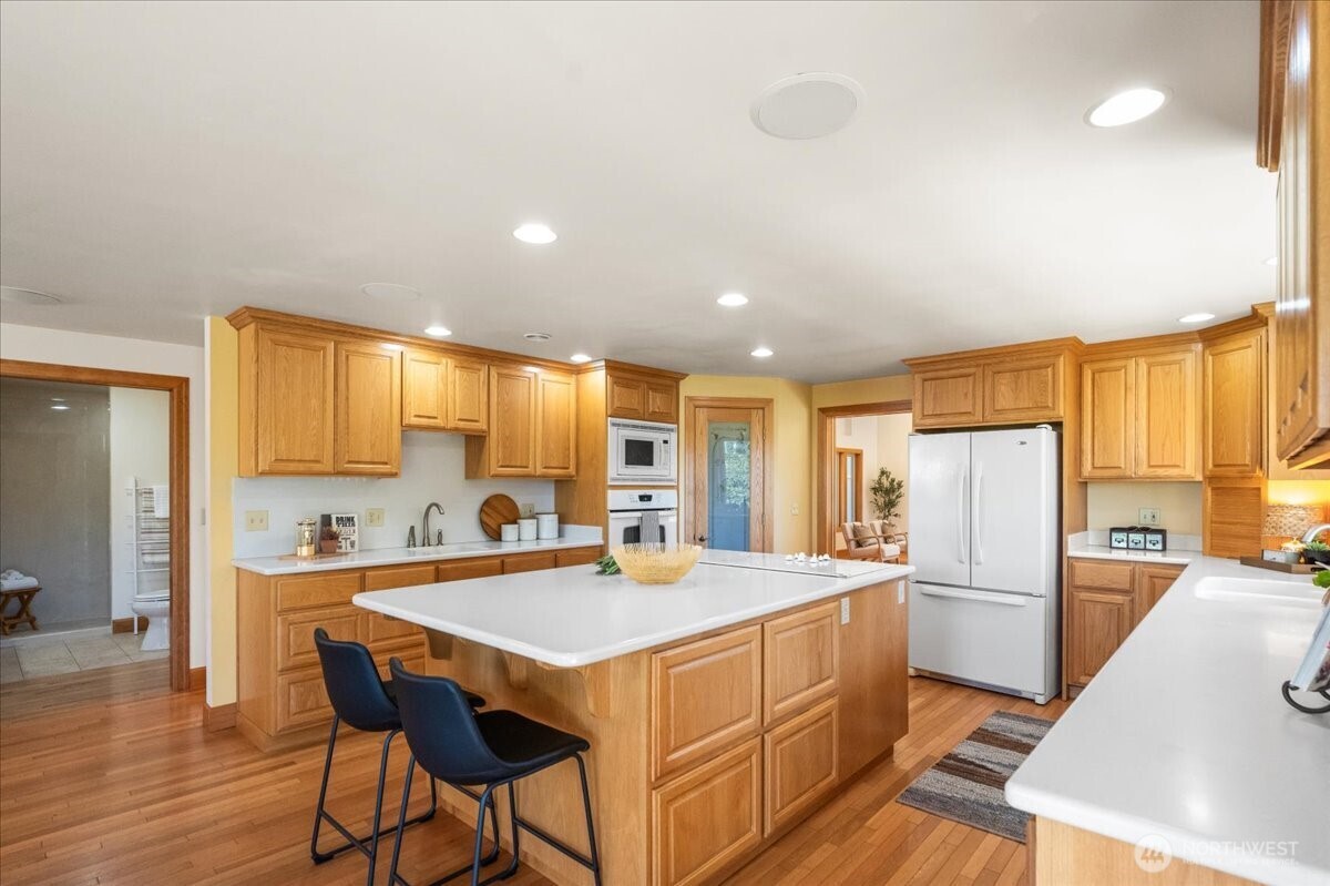 8707 45th Street West Tacoma, WA 98466 - Photo 17 of 39 a kitchen with stainless steel appliances a sink and a refrigerator