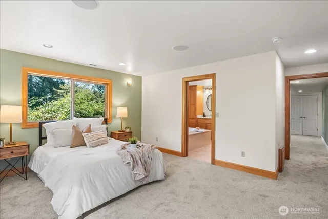 a bedroom with bed and bathroom