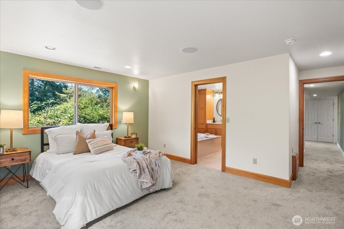 8707 45th Street West Tacoma, WA 98466 - Photo 22 of 39 a bed room with a bed and a large window