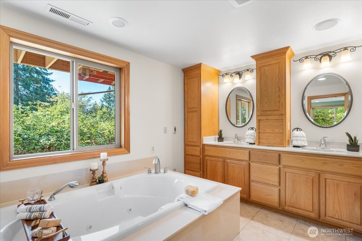8707 45th Street West Tacoma, WA 98466 - Photo 24 of 39 a bathroom with a sink and a large mirror