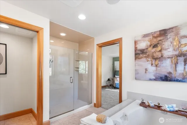 a living room with a flat screen tv and floor to ceiling window