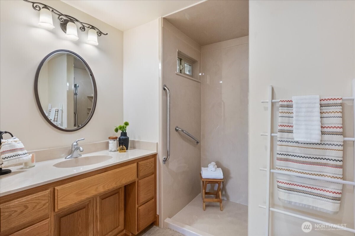 8707 45th Street West Tacoma, WA 98466 - Photo 27 of 39 a bathroom with a sink a toilet and a mirror