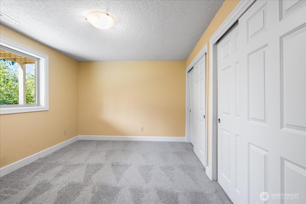 8707 45th Street West Tacoma, WA 98466 - Photo 29 of 39 a view of an empty room with a window