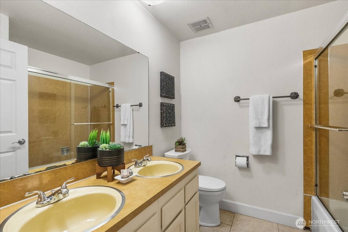 8707 45th Street West Tacoma, WA 98466 - Photo 32 of 39 a bathroom with a granite countertop sink toilet and shower