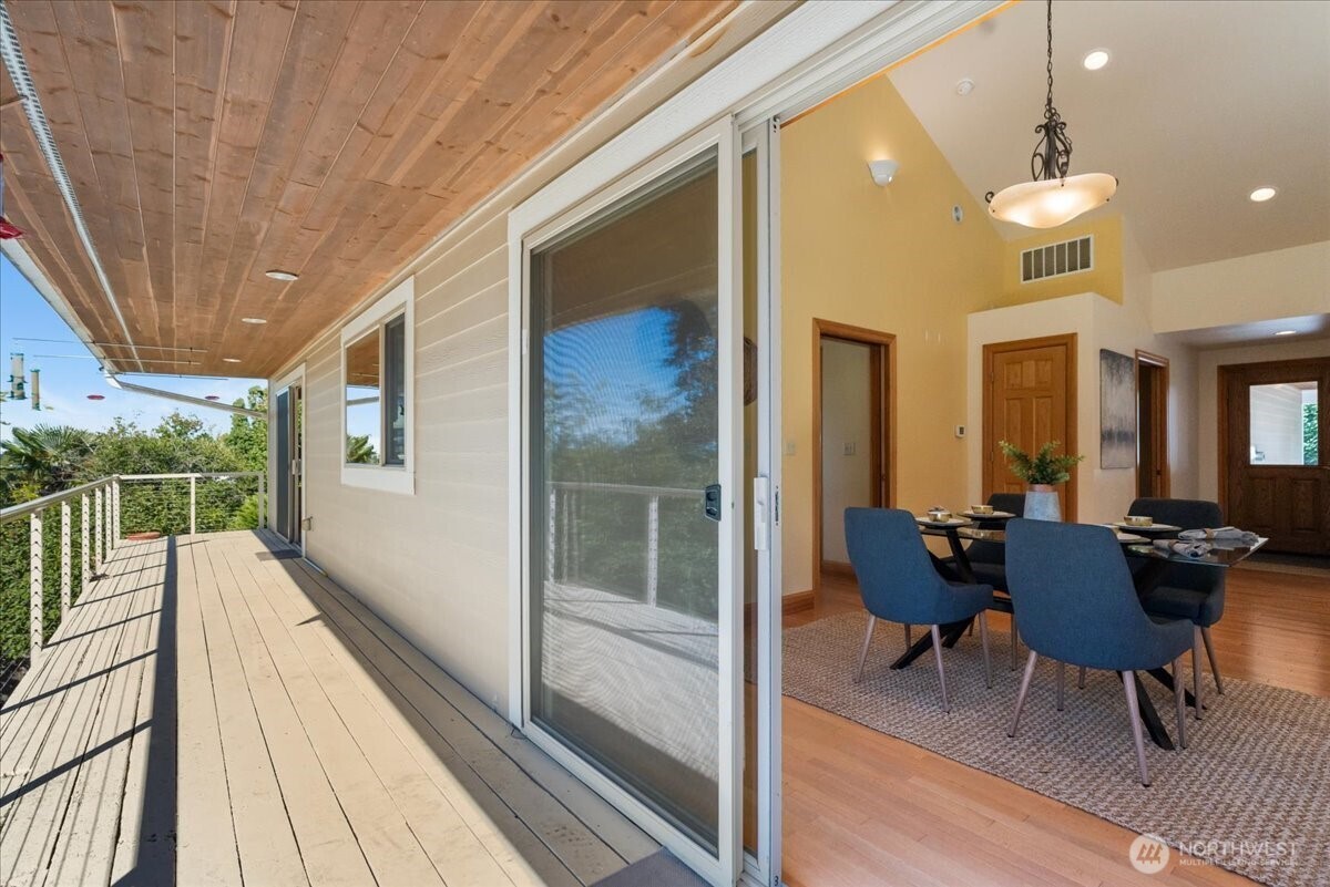 8707 45th Street West Tacoma, WA 98466 - Photo 35 of 39 a balcony with chairs and wooden floor