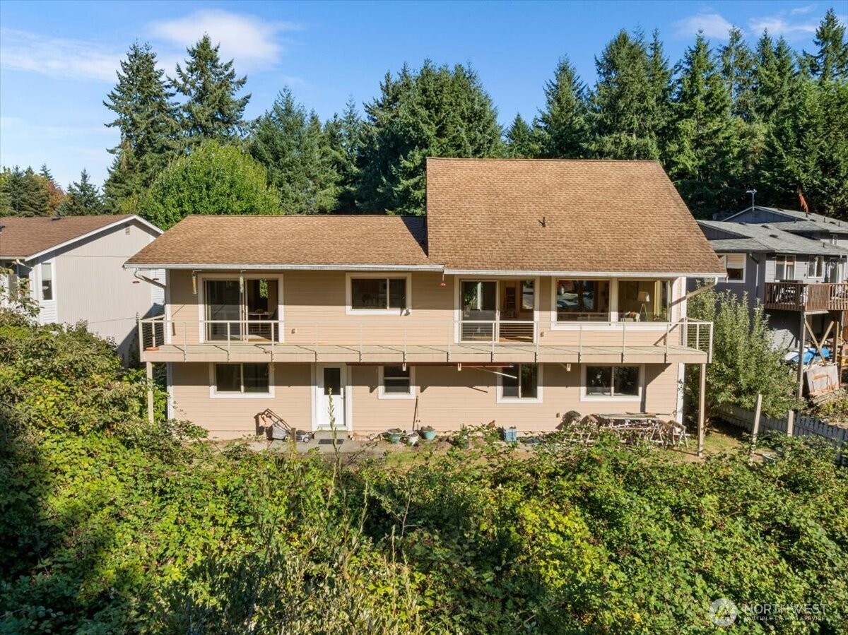 8707 45th Street West Tacoma, WA 98466 - Photo 37 of 39 a aerial view of a residential apartment building with a yard